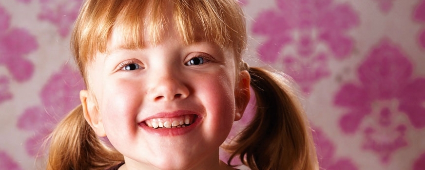 Girl on Pink Wallpaper Backdrop