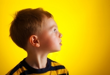 Child on Yellow Backdrop