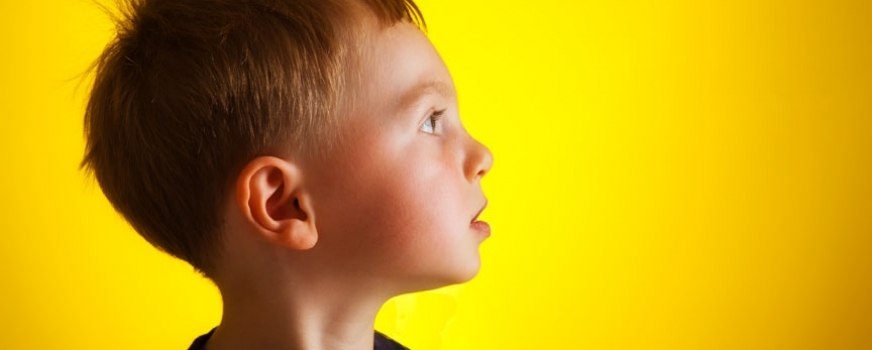 Child on Yellow Backdrop